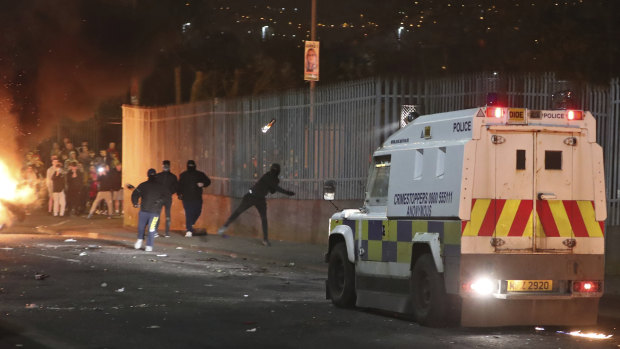 Petrol bombs are thrown at police in Creggan, Londonderry, in Northern Ireland.