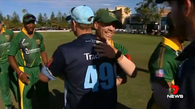 Smith and David Warner embrace after a match between Sutherland and Randwick Petersham in the summer.
