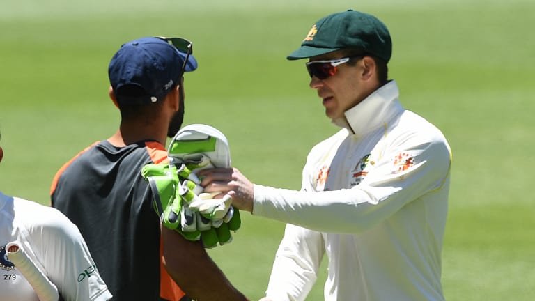 Polite: After their earlier clashes, Tim Paine and Virat Kohli shake hands.