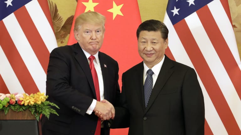 US President Donald Trump, left, and China's President Xi Jinping have clashed over an increasing trade war.