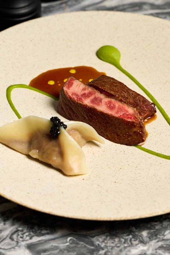 Australian Wagyu flat iron with organic pea puree and handmade wagyu beef dumpling.