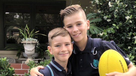 Brothers Noah Newstead, 7, and Jacob Newstead, 10, are excited to throw aside their masks on Tuesday.