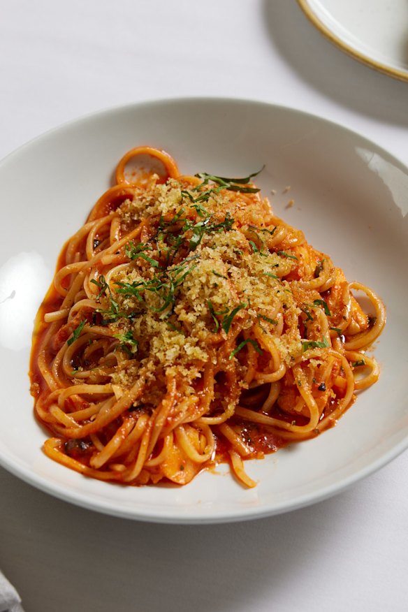 Lobster pasta with tomato, parsley and lemon zest.