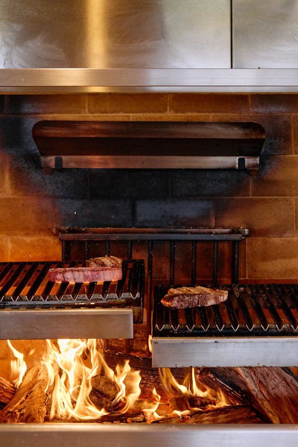 A double parrilla grill that takes centre stage in an open kitchen with low-set bench tops.