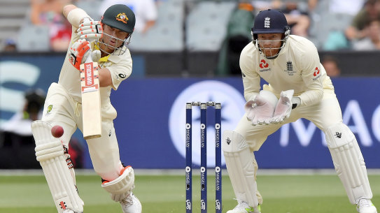Old foes: Jonny Bairstow watches David Warner drive during the fifth day of their MCG Test in 2017.
