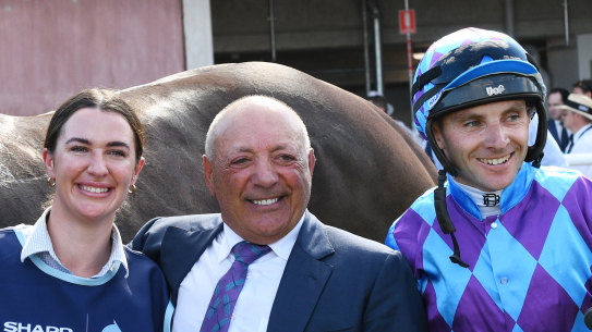 Winning connections: Jockey Declan Bates poses with owner Tony Ottobre (middle) after Pride of Jenni’s win.