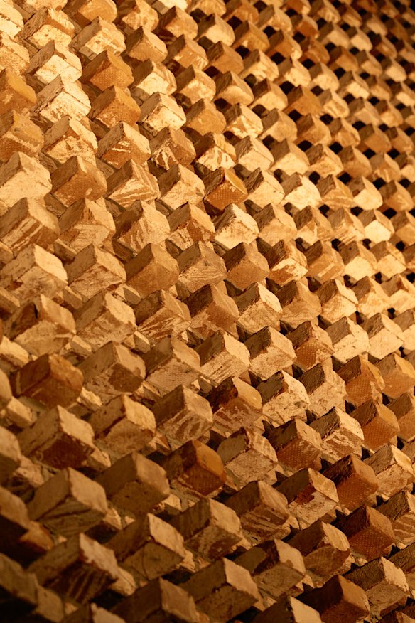 The venue’s facade features a striking brick screen that lights up at night.