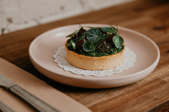 The shawarma duck liver parfait with a savoury herbed tart and pomegranate gel.