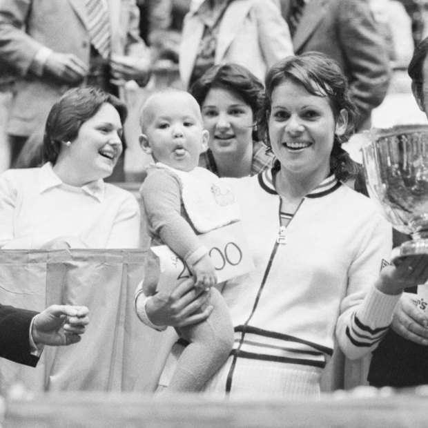 Evonne Goolagong Cawley holds daughter Kelly after winning a tournament in 1978. 