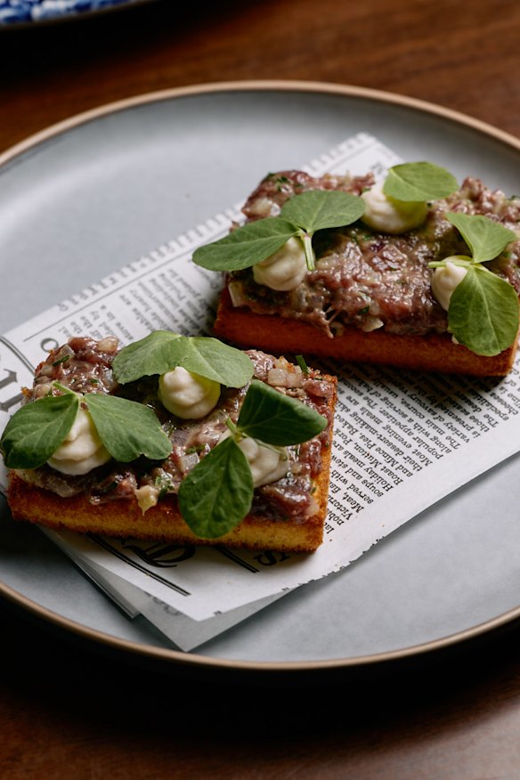 Kangaroo tartare with an onion and bean puree on toasted brioche.