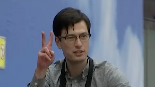 Australian student Alex Sigley arrives at the airport in Beijing on Thursday.