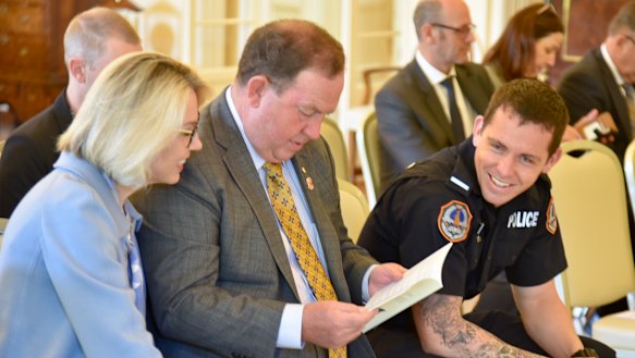 Constable Zach Rolfe at Government House with his parents Debbie and Richard.