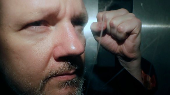 WikiLeaks founder Julian Assange being taken from court on Wednesday.