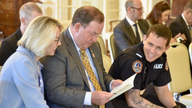 Constable Zach Rolfe at Government House with his parents Debbie and Richard.