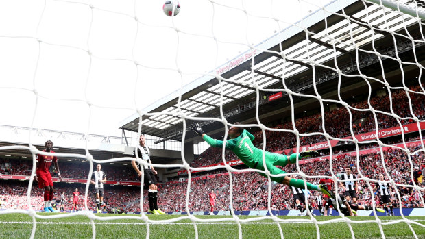Sadio Mane of Liverpool scores his team's first goal past Martin Dubravka of Newcastle United at Anfield.