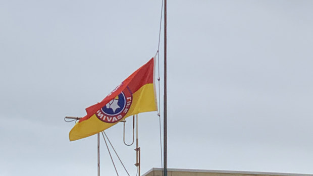 Both the local surf life saving club and the police station had flags flying at half-mast on Monday.