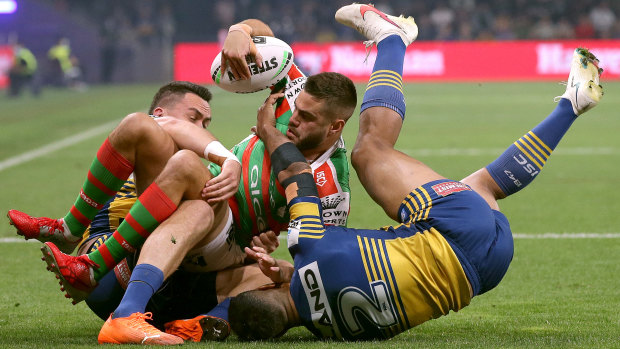 Rabbitohs fullback Corey Allan gets hauled down by the Eels defence in their semi-final.