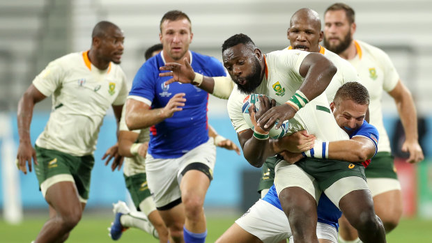 One-way traffic: Tendai Mtawarira of South Africa brought down by the Namibian defence.