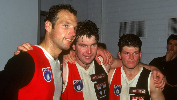 Danny Frawley, centre, celebrates a Saints win with Stuart Loewe and Robert Harvey in 1995.