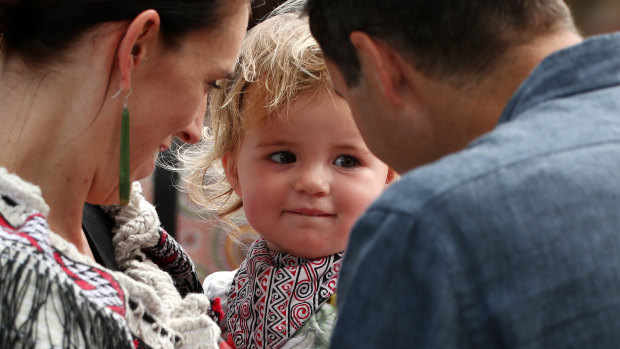 New Zealand Prime Minister and her partner Clarke Gayford with their daughter Neve Gayford at the upper Treaty grounds at Waitangi.