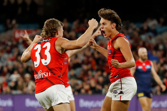 Tex Wanganeen (right) celebrates his first AFL goal.