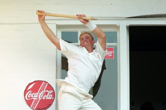 Warne celebrates on the Trent Bridge balcony after victory over England in the fifth Test in 1997.
