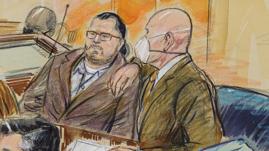 This artist sketch depicts Guy Wesley Reffitt, joined by his lawyer William Welch.