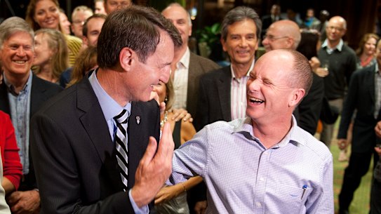 Lord mayor Graham Quirk and Campbell Newman celebrate after Cr Quirk won the election in 2012. 