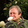 Former Essendon coach Kevin Sheedy stops to smell the roses at the Kilmore Rose Cafe.