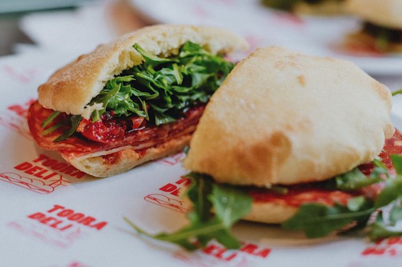A house-baked puccia filled with hot salami, provolone, semi-dried tomatoes, rocket and Italian chilli at Tooradeli.