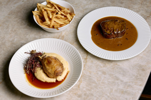 Confit duck with potato mash and a duck jus, and grass-fed eye fillet with pepper cognac sauce and French fries.