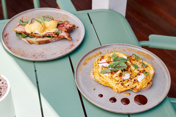 Eggs Benjamin with kaiserfleisch bacon and kimchi hollandaise, and ’nduja scrambled eggs with soft herbs, smoked yoghurt, macadamia, and a biang biang sauce.
