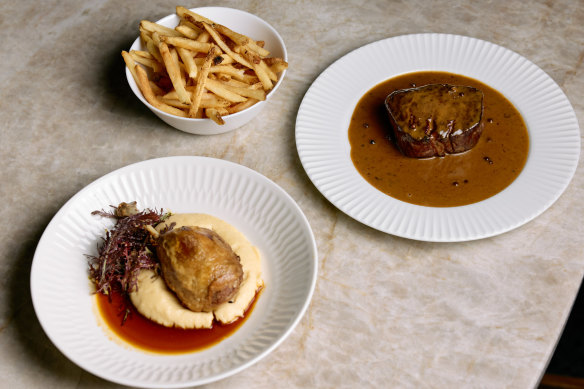 Confit duck with potato mash and a duck jus, and grass-fed eye fillet with pepper cognac sauce and French fries.