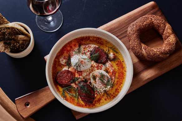 Emils’ Turkish eggs with sujuk sausage and simit bread.