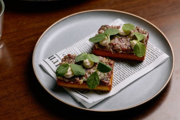 Kangaroo tartare with an onion and bean puree on toasted brioche.