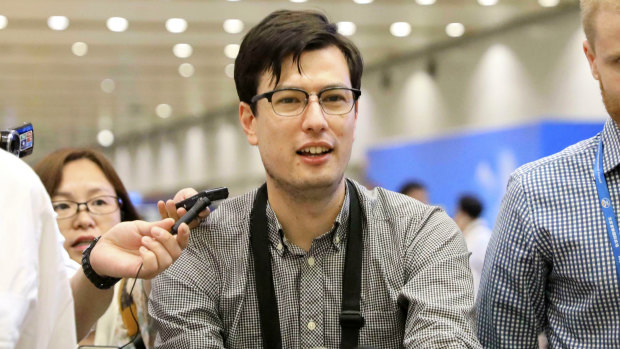Australian student Alek Sigley arriving at the airport in Beijing after be was released from North Korea in July last year.