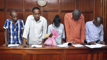 From left to right, suspects Osman Ibrahim, Guleid Abdihakim, Gladys Kaari Justus, Oliver Kanyango Muthee and Joel Nganga Wainaina appear at a hearing at Milimani law courts in Nairobi on Friday. 