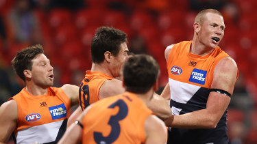 Sam Jacobs (right) celebrates kicking a goal against Richmond last weekend.