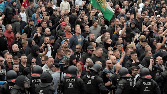 Men shout during a far-right protest in Chemnitz.