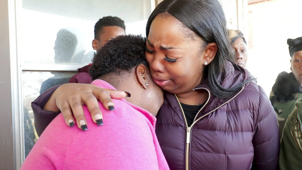 Bernice Parks, left, is consoled following the death of her daughter. 