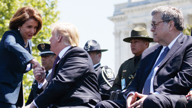 Attorney General William Barr looks on as President Donald Trump shakes hands with Speaker of the House Nancy Pelosi during the 38th Annual National Peace Officers' Memorial Service.