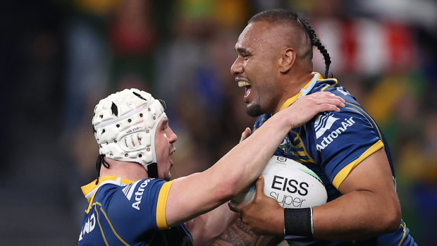 Junior Paulo and Reed Mahoney celebrate a try.