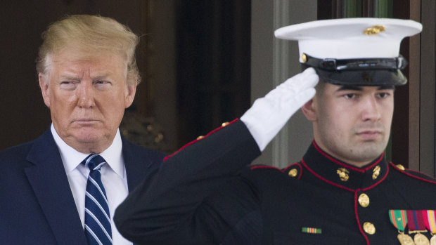 President Donald Trump watches as Canadian Prime Minister Justin Trudeau departs the White House on Thursday.