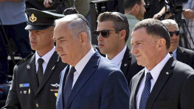 Israeli Prime Minister Benjamin Netanyahu, centre, and Knesset Speaker Yuli Edelstein, right.