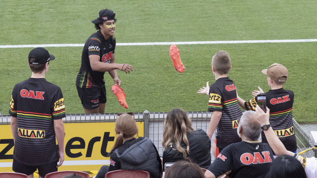 Jarome Luai pleases some fans by throwing them his boots.