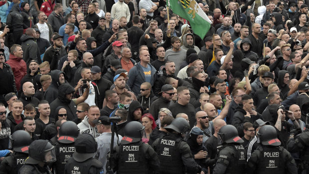 Men shout during a far-right protest in Chemnitz.