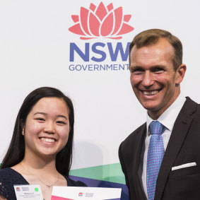Rebecca Lin from Thomas Hassall Anglican College topped the state in English extension 2. She is pictured with NSW Education Minister Rob Stokes