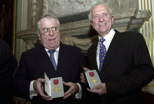 Albert, left and Michel Roux display their honourary OBE medals presented to them by the British Foreign Secretary Jack Straw, on behalf of Britain's Queen Elizabeth, at a ceremony at the Foriegn and Commonwealth offices in central London, 2002. 
