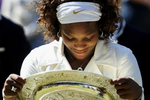 Serena Williams with her 2009 Wimbledon trophy.