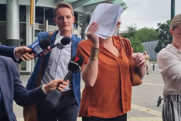 Rani Paige Lowry (centre) leaves the Brisbane Magistrates Court on Thursday.